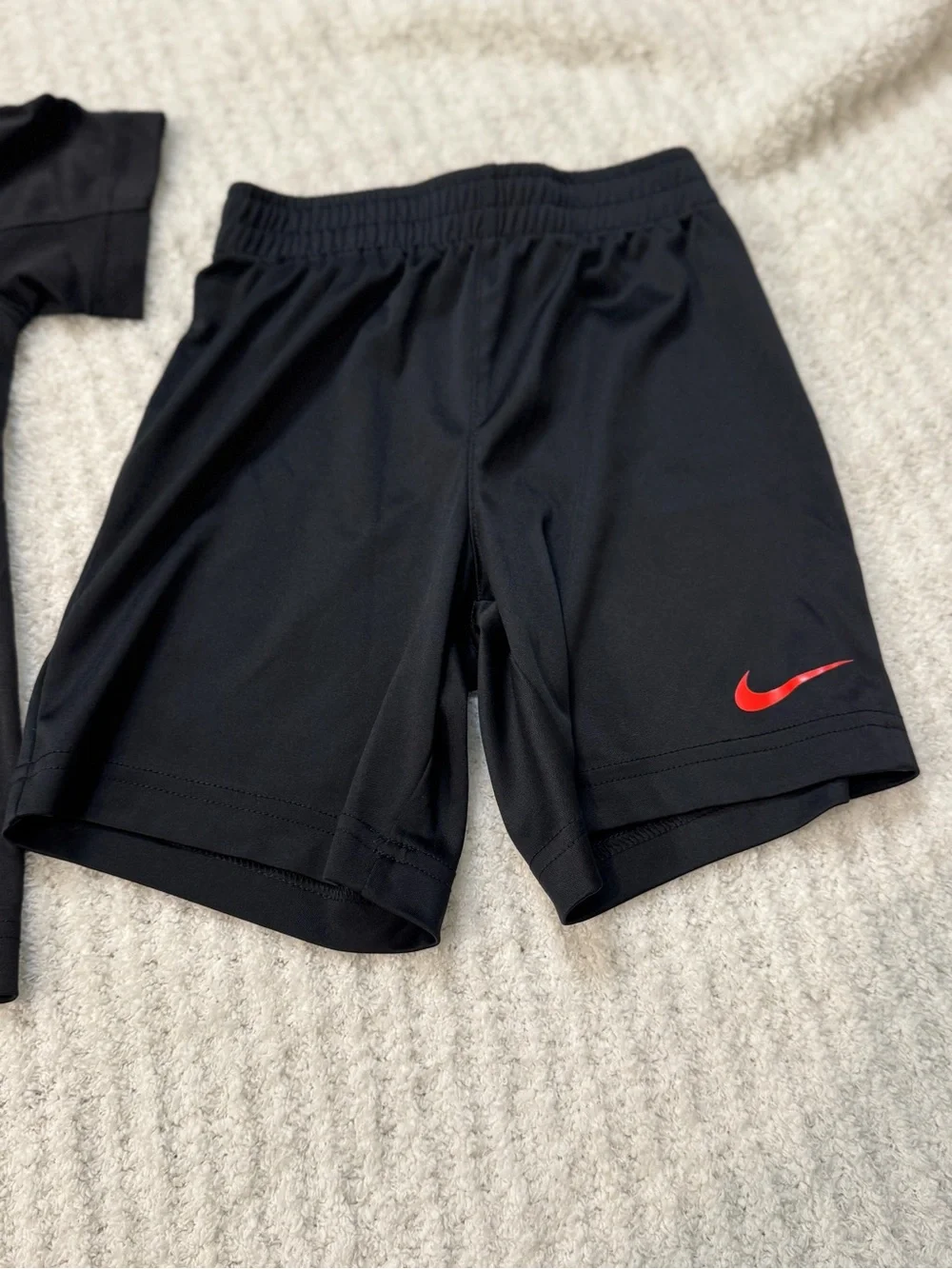 Nike Kids Black Short Sleeve Tee with Red Graphic